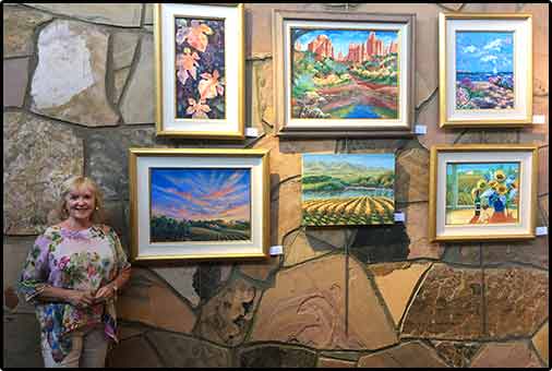 Joan with paintings 2018 MTRP show